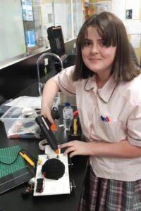 A Mary MacKillop Catholic College Wakeley female student building a solar car